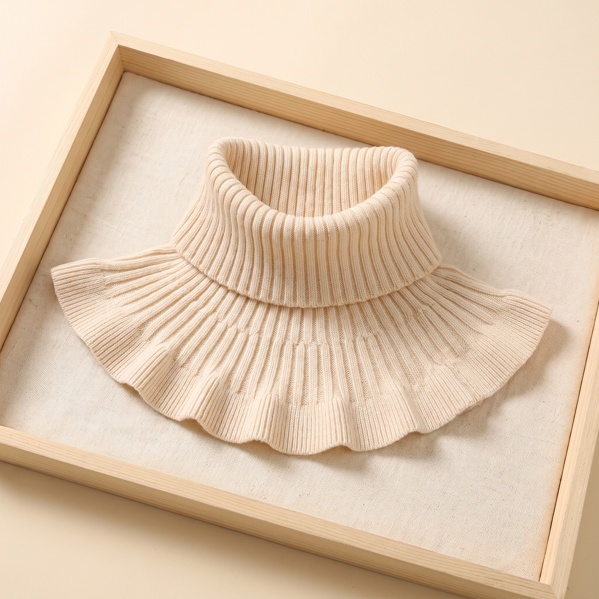 SITRĀ Knitted Ruffle Collar — flat lay