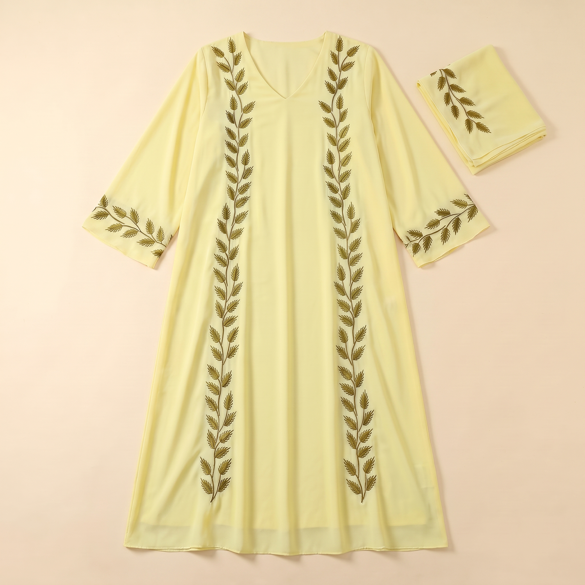 SITRĀ Amira Embroidered Abaya — Yellow flat lay