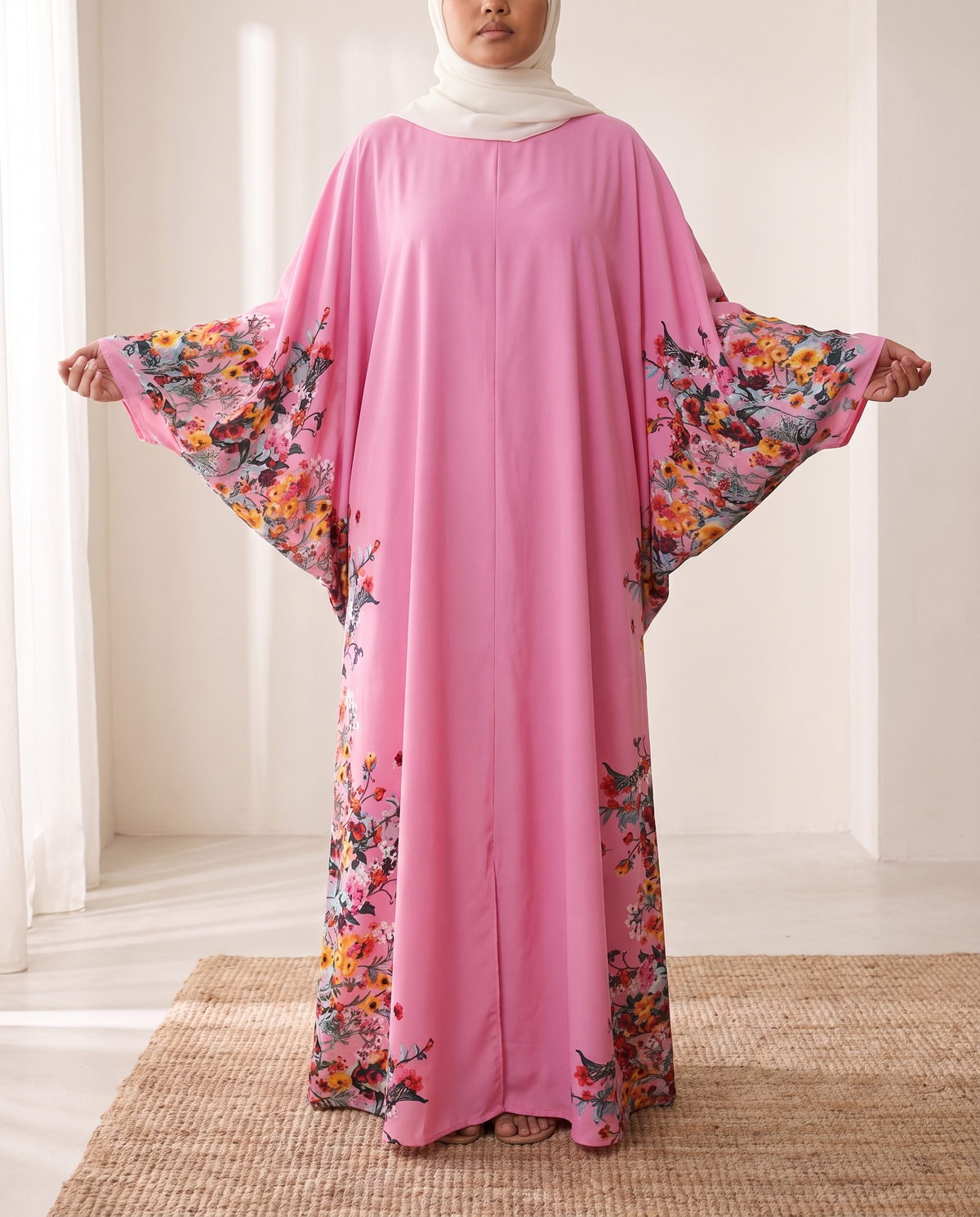 SITRĀ Batwing Sleeve Printed Maxi Abaya — Pink Floral Border (model Leila)