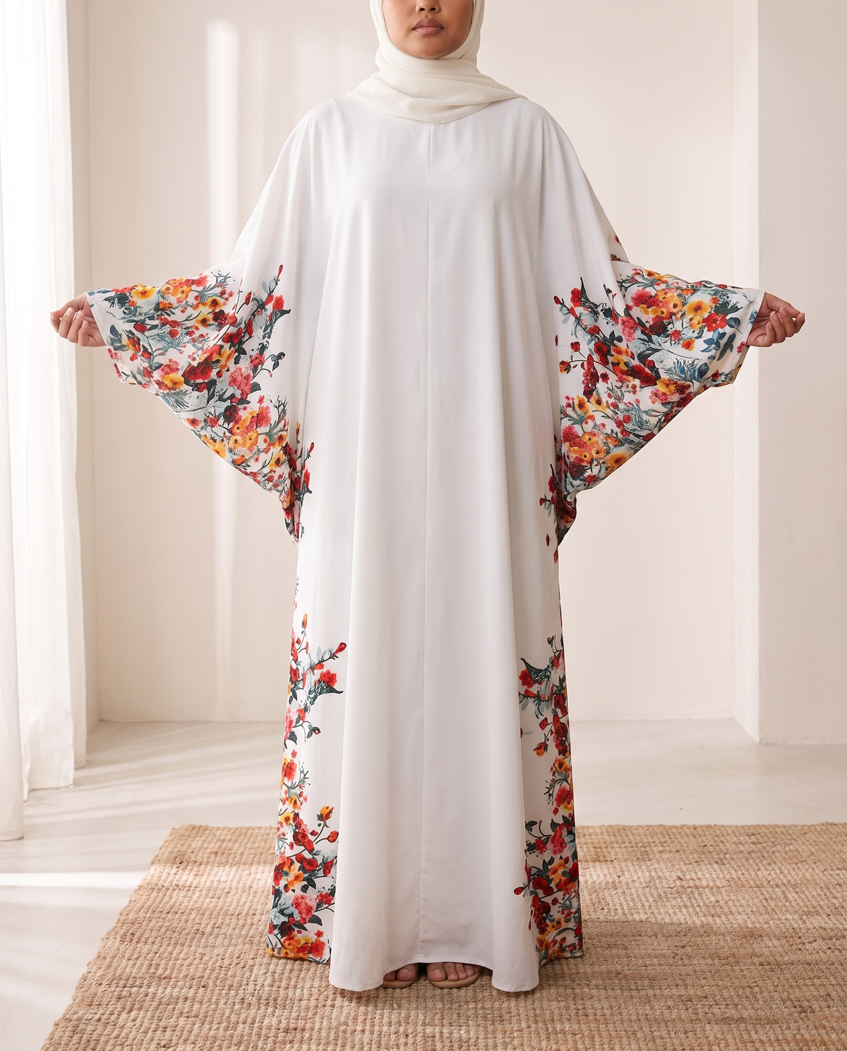SITRĀ Batwing Sleeve Printed Maxi Abaya — White Floral Border (model Leila)