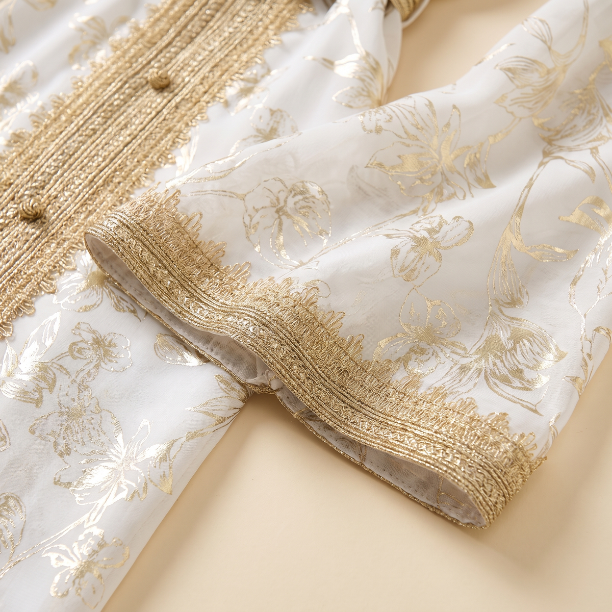 SITRĀ Belted Kaftan for Evening Wear — gold trim detail