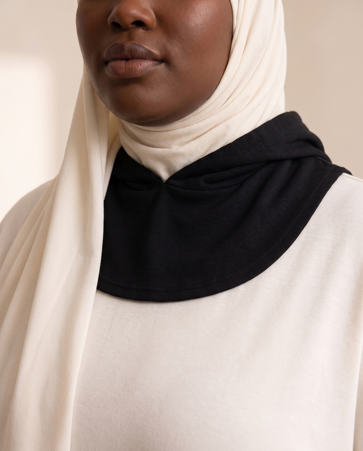 Detachable High-Neck Collar in Black Hooded, worn
