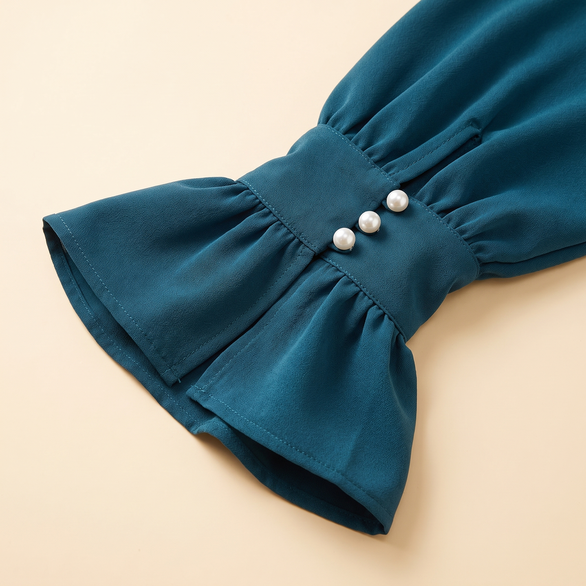 Ruffle-cuff abaya dress — pearl-button flounce cuff detail
