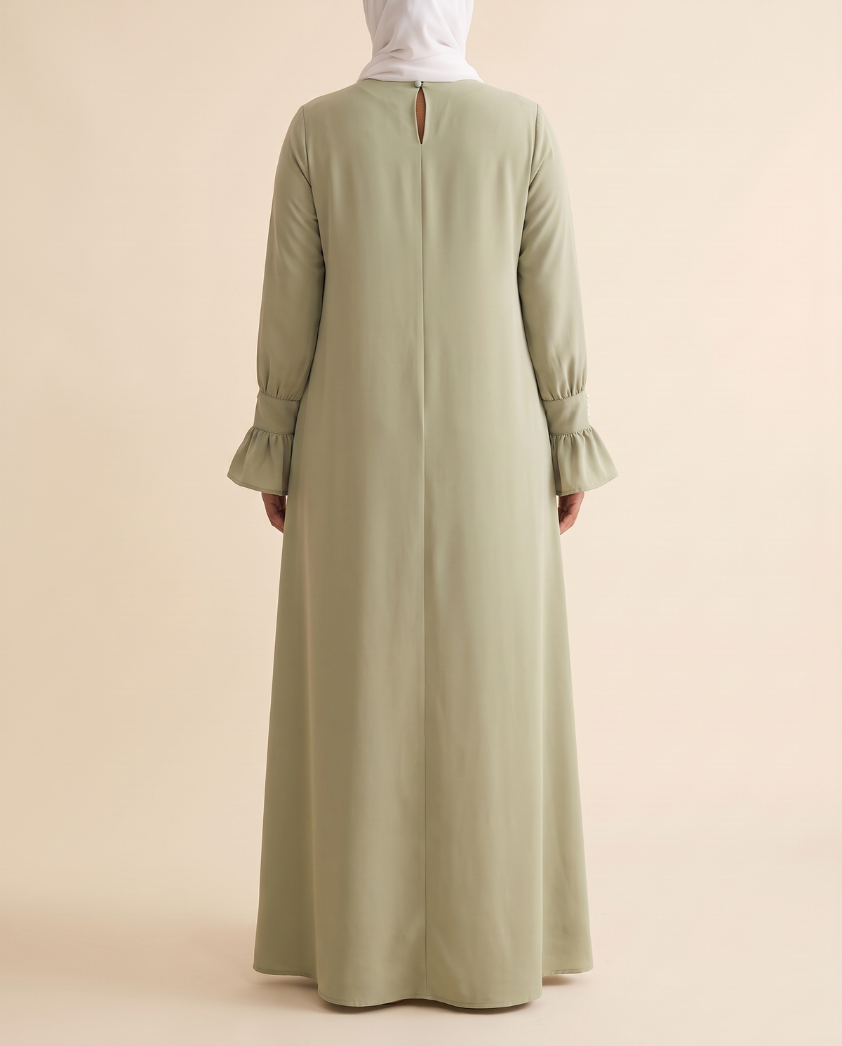 Ruffle-cuff abaya dress in Sage, back view