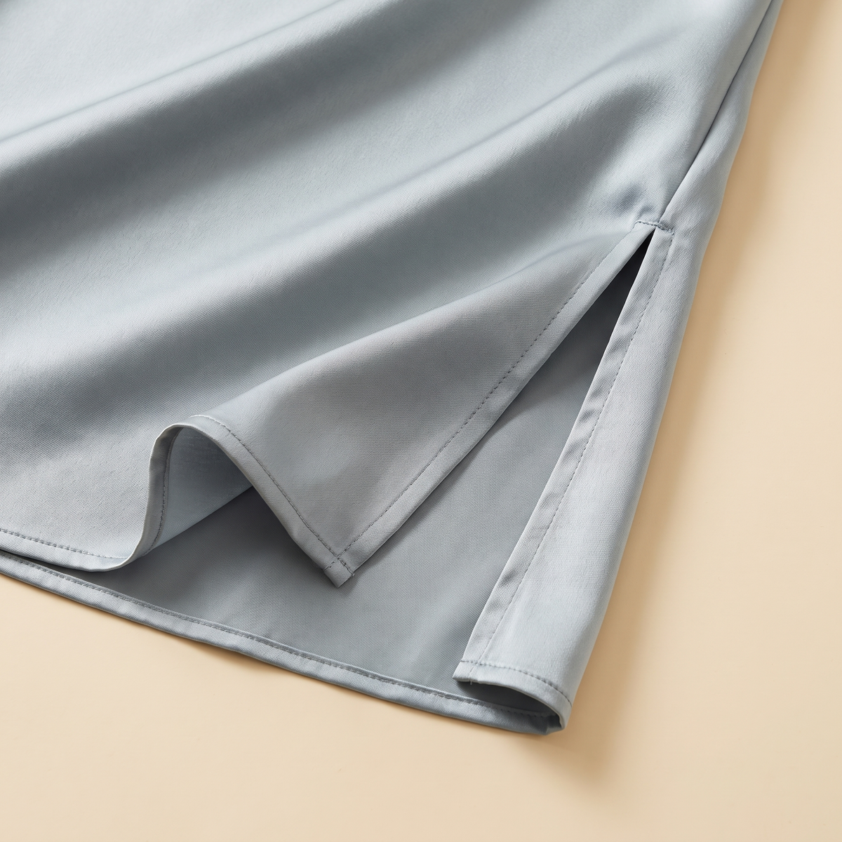 Sleeveless satin slip underdress — satin fabric and side slit detail