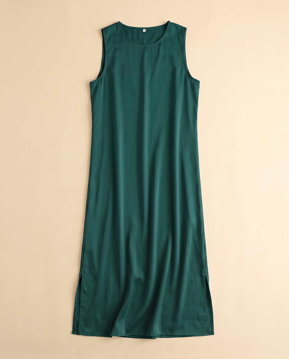 Sleeveless satin slip underdress in Emerald, flat lay
