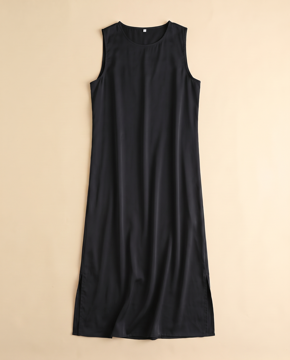 Sleeveless satin slip underdress in Black, flat lay