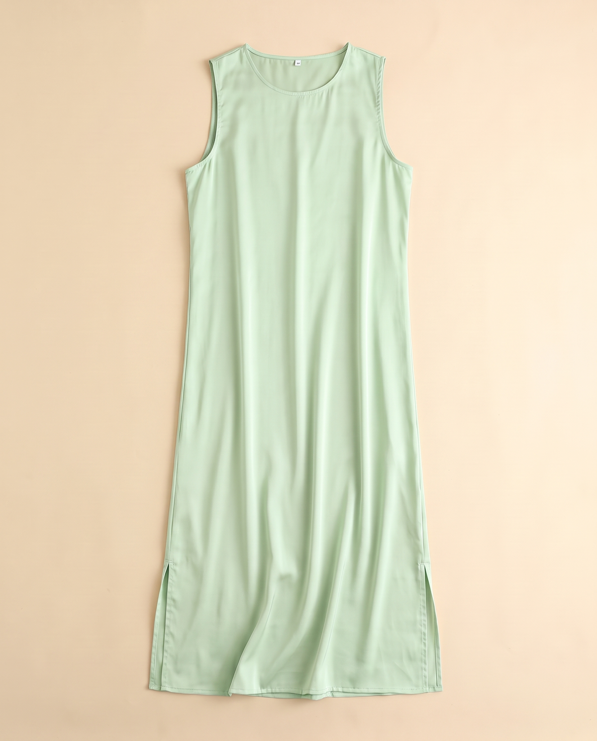 Sleeveless satin slip underdress in Pale Mint, flat lay