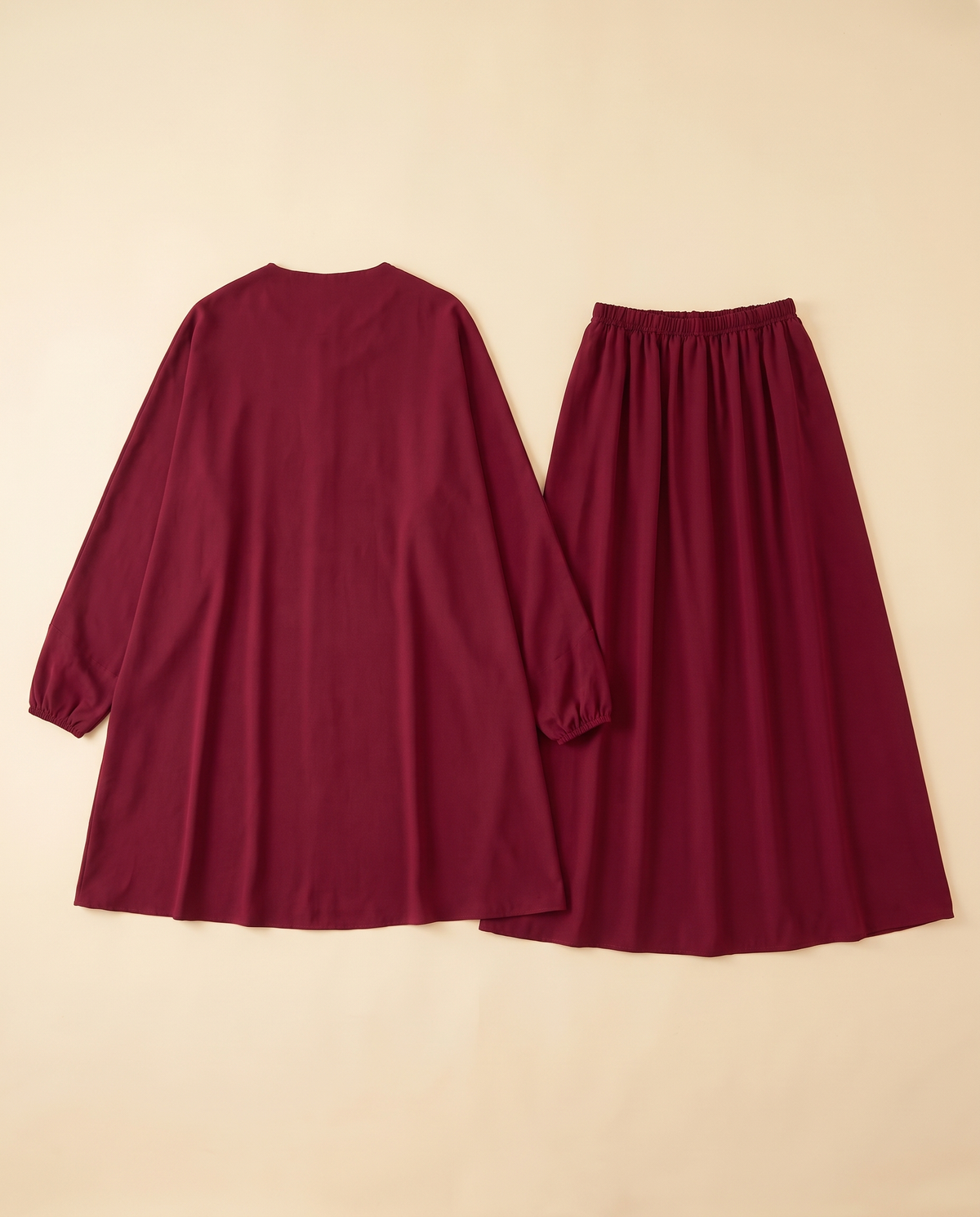 Two-piece khimar and skirt prayer set in Wine Red, flat lay