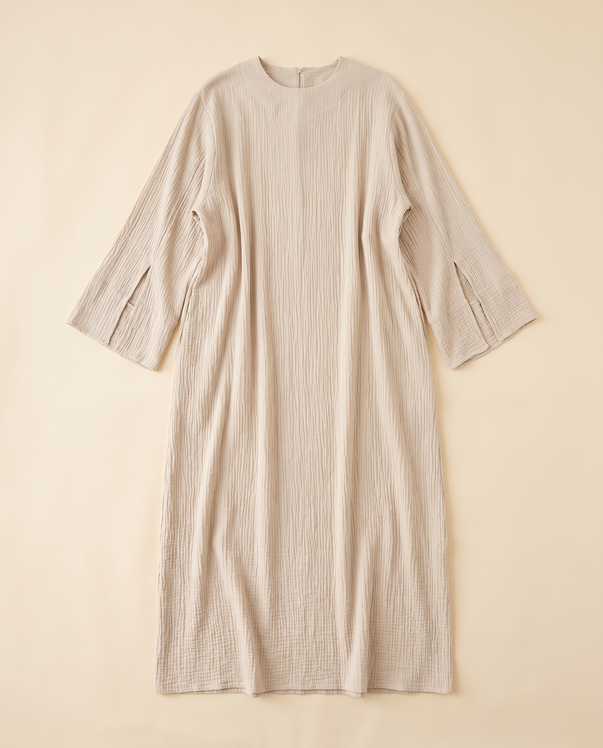 Wijdan textured split-sleeve abaya in Oatmeal, flat lay