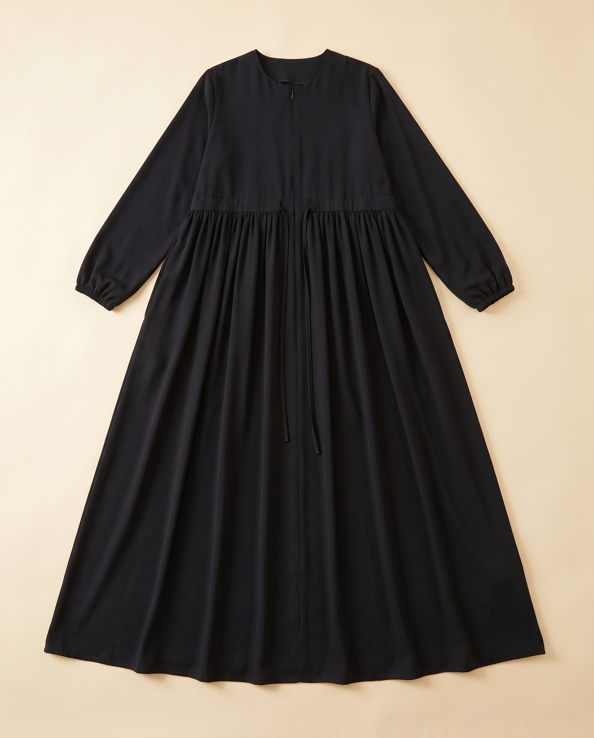 Zip-front swing abaya in Black, flat lay