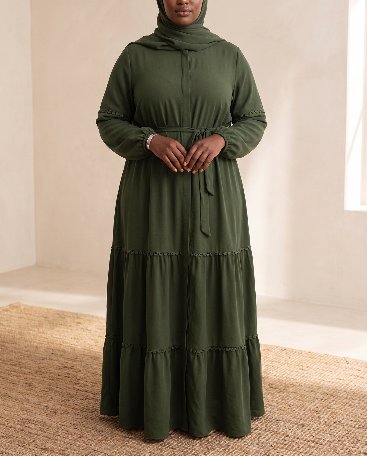 Belted kaftan abaya in deep green worn