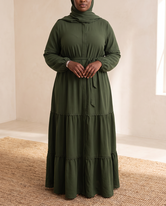 Belted kaftan abaya in deep green worn